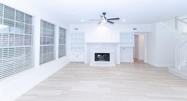 1106 Timbercreek Dr, Allen, TX 75002 - unfurnished living room featuring stairway, a ceiling fan, a fireplace, light wood-style floors, and recessed lighting