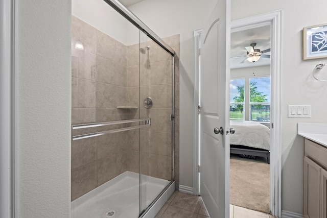 1021 Adelyn St, Anna, TX 75409 - ensuite bathroom with a stall shower, vanity, ceiling fan, and tile patterned flooring