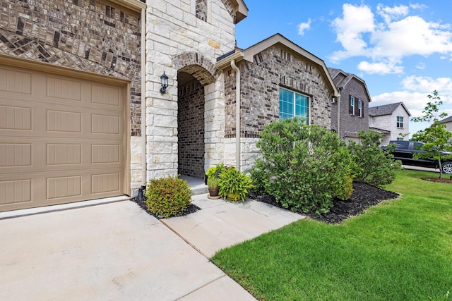 1021 Adelyn St, Anna, TX 75409 - property entrance featuring stone siding, a yard, and driveway