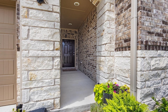 1021 Adelyn St, Anna, TX 75409 - view of exterior entry featuring stone siding and brick siding