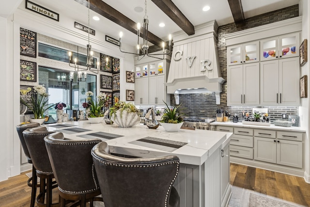 1001 Colina Vista Ln, Crowley, TX 76036 - kitchen featuring a chandelier, backsplash, a kitchen island with sink, dark wood finished floors, and beam ceiling