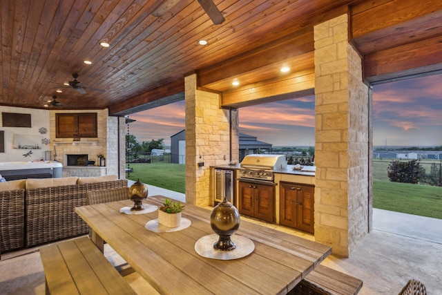 1001 Colina Vista Ln, Crowley, TX 76036 - dining area featuring a ceiling fan, wood ceiling, beverage cooler, and an outdoor stone fireplace
