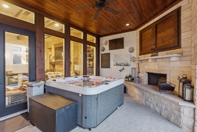 1001 Colina Vista Ln, Crowley, TX 76036 - view of patio with an outdoor stone fireplace, a hot tub, and a ceiling fan