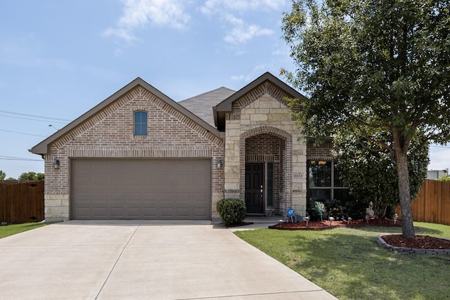 2133 Blakely Ct, Fort Worth, TX 76134 - french country style house with brick siding, concrete driveway, an attached garage, and stone siding