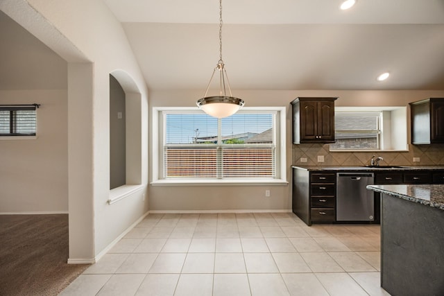 2133 Blakely Ct, Fort Worth, TX 76134 - kitchen featuring stainless steel dishwasher, healthy amount of natural light, dark brown cabinets, decorative backsplash, and lofted ceiling