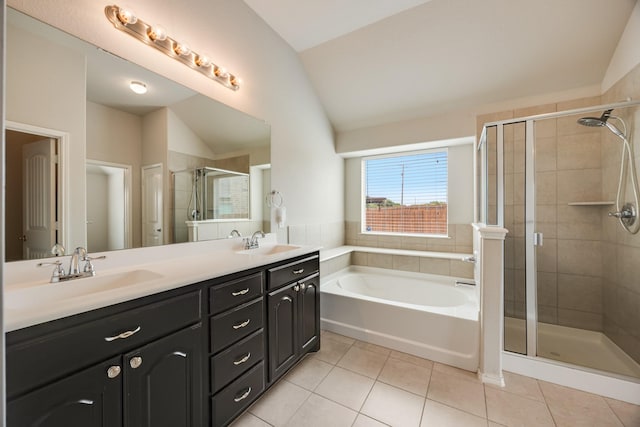 2133 Blakely Ct, Fort Worth, TX 76134 - full bath with vaulted ceiling, tile patterned flooring, a stall shower, a garden tub, and double vanity