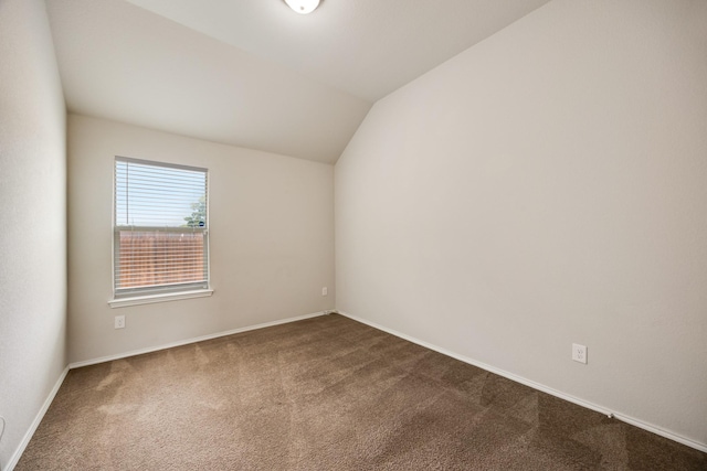 2133 Blakely Ct, Fort Worth, TX 76134 - unfurnished room featuring dark colored carpet, lofted ceiling, and baseboards