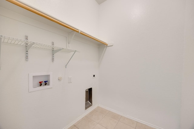 2133 Blakely Ct, Fort Worth, TX 76134 - laundry room with electric dryer hookup, baseboards, washer hookup, light tile patterned floors, and hookup for a gas dryer