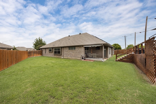 2133 Blakely Ct, Fort Worth, TX 76134 - back of property featuring roof with shingles, a patio area, and brick siding