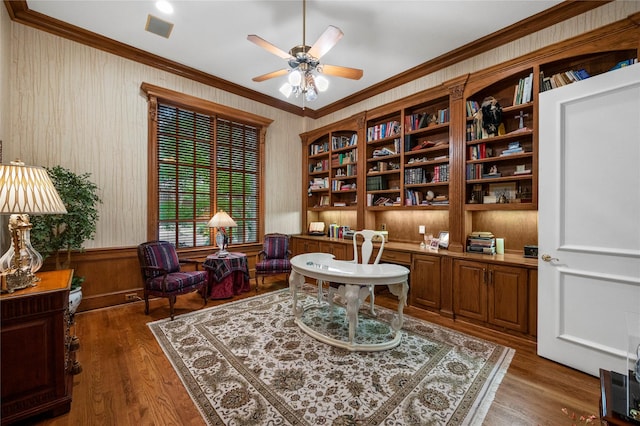 1524 Eastwick Ln, Plano, TX 75093 - home office with ornamental molding, a ceiling fan, wood finished floors, and wooden walls