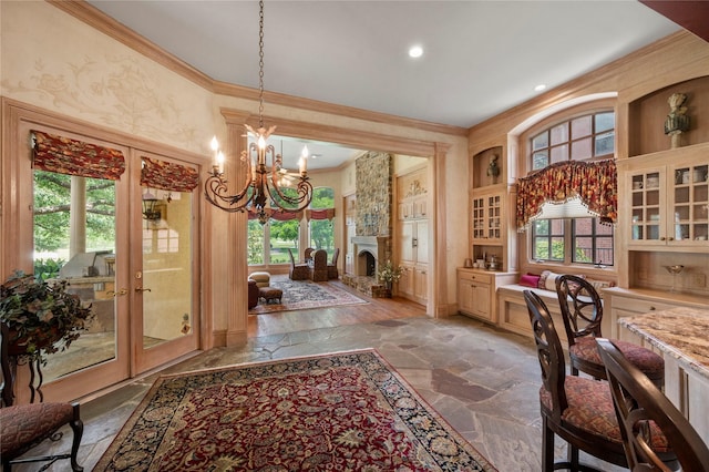 1524 Eastwick Ln, Plano, TX 75093 - home office with ornamental molding, a chandelier, light stone finish flooring, a fireplace, and recessed lighting