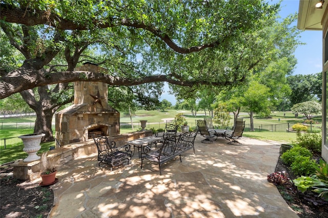 1524 Eastwick Ln, Plano, TX 75093 - view of patio with an outdoor stone fireplace and golf course view