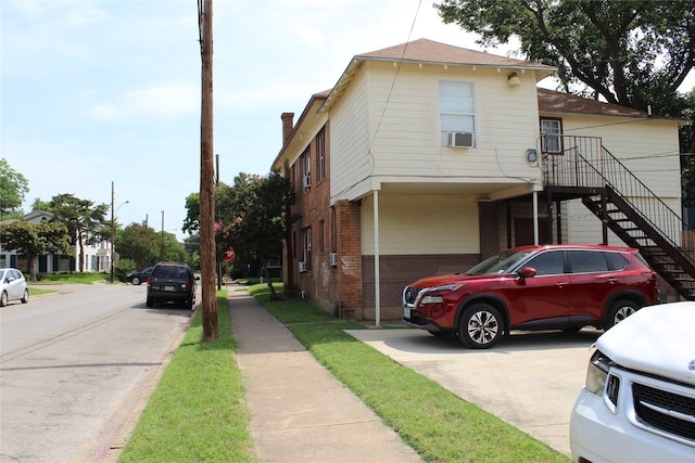 1130 Kings Hwy, Dallas, TX 75208 - view of front of home with brick siding, a chimney, and stairs