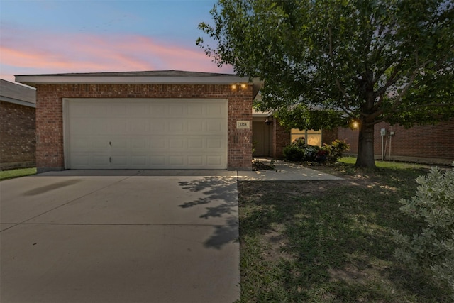 3328 Royal Crest Dr, Fort Worth, TX 76140 - view of front of house featuring brick siding, concrete driveway, and an attached garage