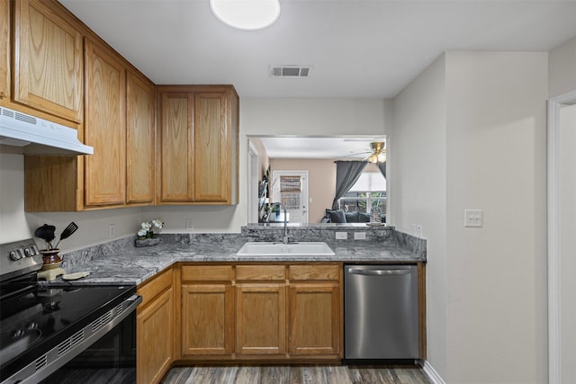 3328 Royal Crest Dr, Fort Worth, TX 76140 - kitchen featuring black electric range, stainless steel dishwasher, a sink, under cabinet range hood, and wood finished floors