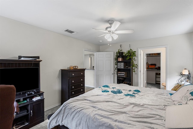3328 Royal Crest Dr, Fort Worth, TX 76140 - bedroom with carpet flooring, a walk in closet, a ceiling fan, a closet, and baseboards