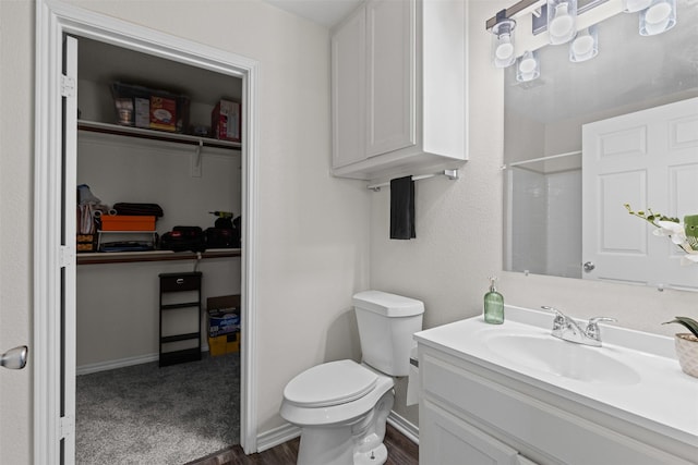 3328 Royal Crest Dr, Fort Worth, TX 76140 - full bathroom featuring toilet, vanity, wood finished floors, a shower, and a spacious closet