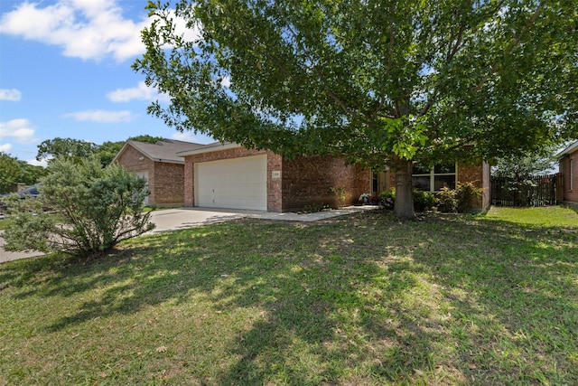 3328 Royal Crest Dr, Fort Worth, TX 76140 - view of front of home with brick siding, concrete driveway, an attached garage, and a front yard