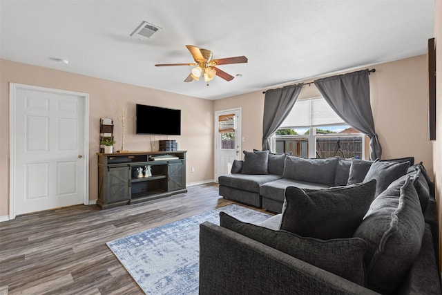 3328 Royal Crest Dr, Fort Worth, TX 76140 - living room featuring ceiling fan, baseboards, and wood finished floors