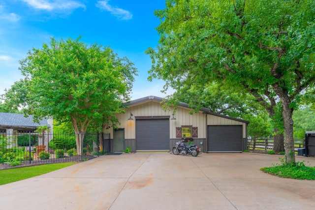 1321 Bridle Bit Rd, Bartonville, TX 75022 - mid-century inspired home with board and batten siding, an outbuilding, and a garage