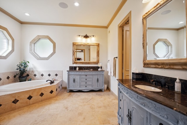 508 Moraine Way, Heath, TX 75032 - bathroom featuring crown molding, two vanities, a bath, and recessed lighting