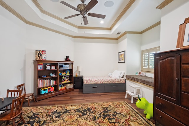 508 Moraine Way, Heath, TX 75032 - bedroom with a raised ceiling, dark wood finished floors, crown molding, and a ceiling fan