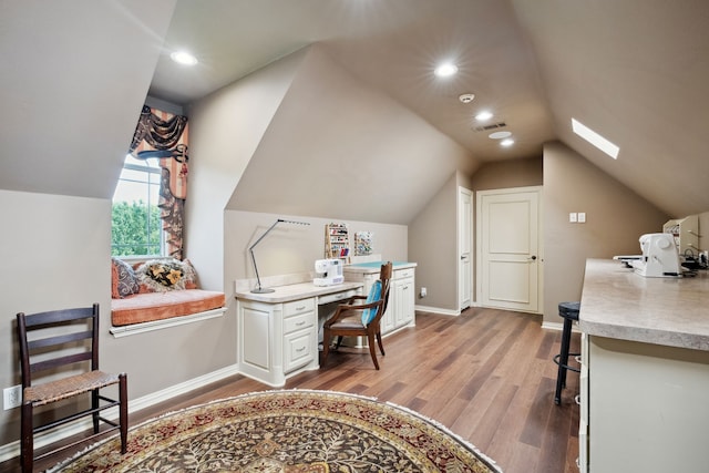 508 Moraine Way, Heath, TX 75032 - office area featuring light wood-type flooring, vaulted ceiling, a skylight, and recessed lighting