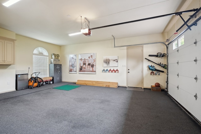 508 Moraine Way, Heath, TX 75032 - garage featuring freestanding refrigerator and a garage door opener