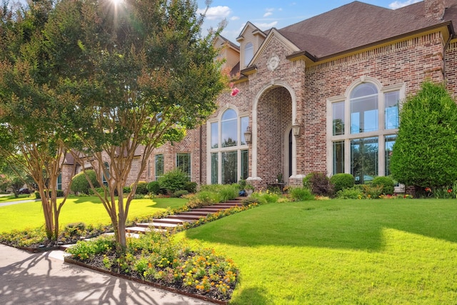 508 Moraine Way, Heath, TX 75032 - view of front facade with brick siding and a front lawn