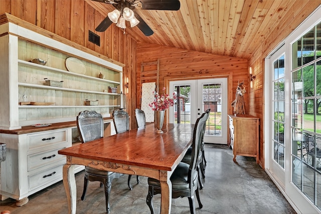 4920 County Road 179, Celina, TX 75009 - dining space with lofted ceiling, wooden walls, french doors, finished concrete flooring, and a ceiling fan