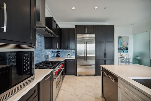 2800 Lakeside Pkwy Unit 501, Flower Mound, TX 75022 - kitchen featuring built in appliances, crown molding, wall chimney range hood, light marble finish flooring, and light countertops