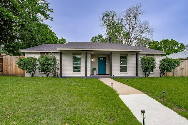 2110 Montana Trl, Grand Prairie, TX 76001 - view of front facade with brick siding and a shingled roof