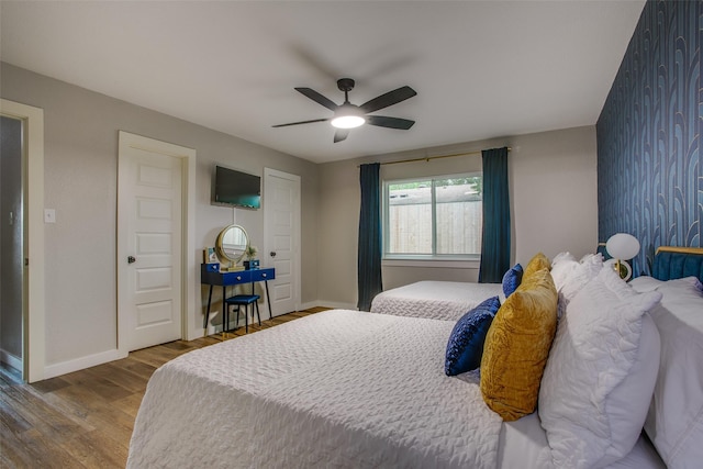 2110 Montana Trl, Grand Prairie, TX 76001 - bedroom featuring baseboards, wood finished floors, and ceiling fan