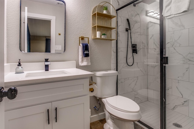 2110 Montana Trl, Grand Prairie, TX 76001 - bathroom featuring toilet, vanity, a marble finish shower, and a textured wall