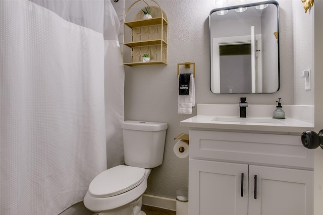 2110 Montana Trl, Grand Prairie, TX 76001 - bathroom with toilet, vanity, a shower with curtain, and baseboards