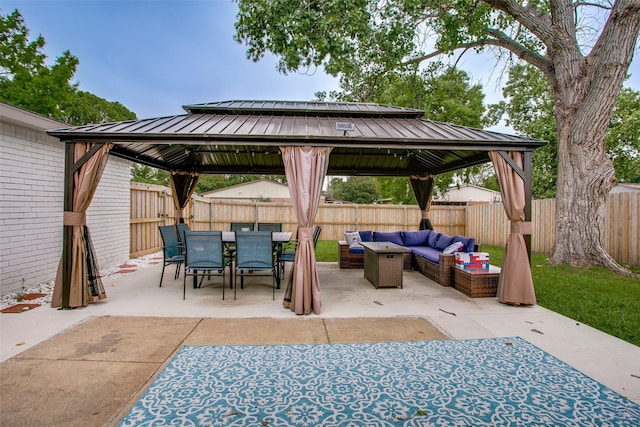 2110 Montana Trl, Grand Prairie, TX 76001 - fenced backyard with a gazebo, outdoor lounge area, a patio area, and outdoor dining area