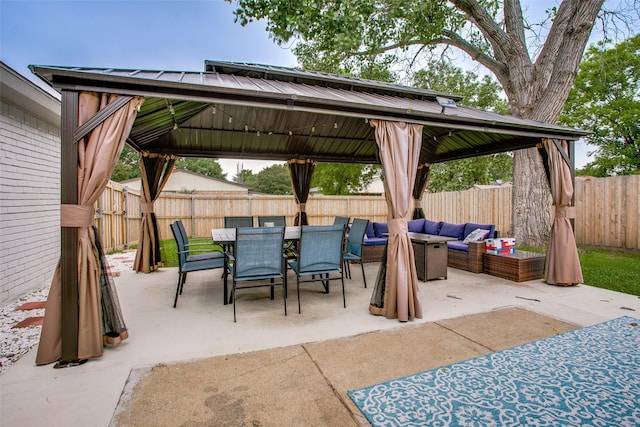 2110 Montana Trl, Grand Prairie, TX 76001 - fenced backyard featuring a gazebo, an outdoor hangout area, outdoor dining area, and a patio
