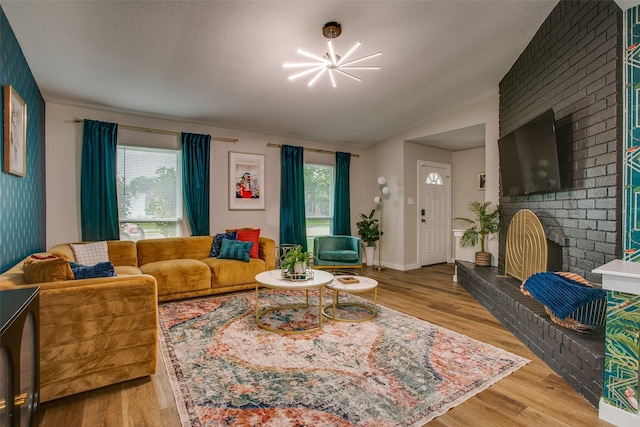 2110 Montana Trl, Grand Prairie, TX 76001 - living area featuring a chandelier, plenty of natural light, light wood-type flooring, and vaulted ceiling