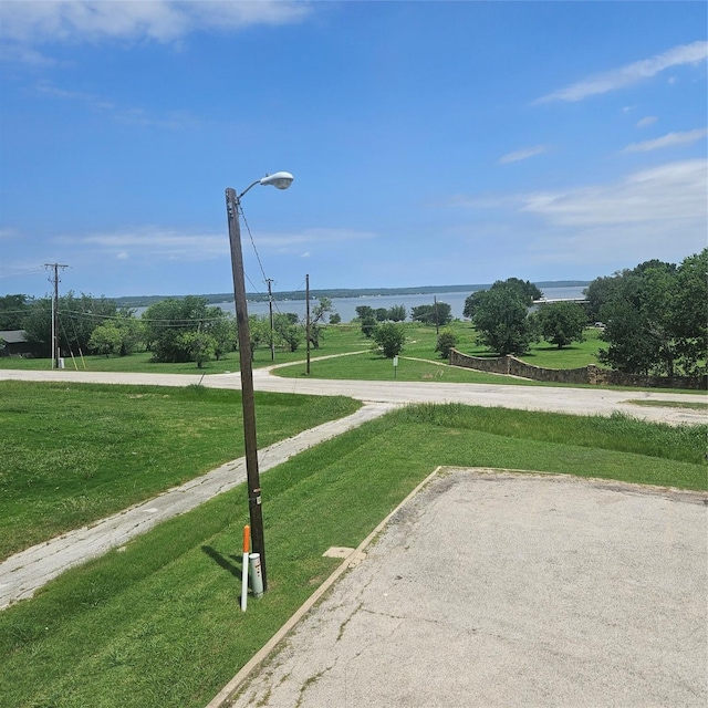 91 Runaway Bay Dr Unit 232, Runaway Bay, TX 76426 - view of home's community with a yard and a water view