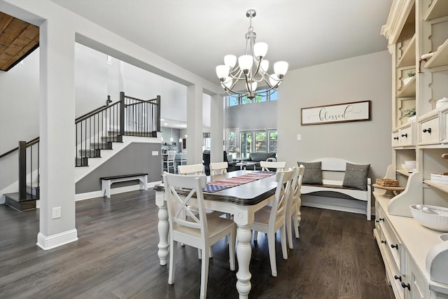 7431 Bald Cypress Dr, Ovilla, TX 75154 - dining area with a chandelier, stairway, dark wood-style flooring, and a high ceiling
