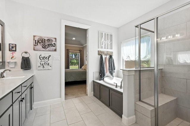 7431 Bald Cypress Dr, Ovilla, TX 75154 - bathroom with a stall shower, a garden tub, vanity, ensuite bath, and tile patterned floors