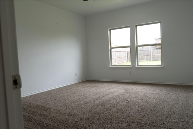 1610 Seadrift Dr, Forney, TX 75126 - carpeted spare room with baseboards and a ceiling fan