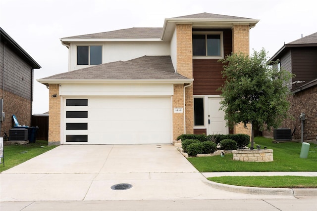 1610 Seadrift Dr, Forney, TX 75126 - view of front of home featuring concrete driveway, a front lawn, a shingled roof, a garage, and stucco siding