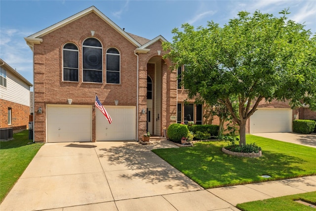 4405 Vista Meadows Dr, Fort Worth, TX 76244 - view of front facade with concrete driveway, a front lawn, a garage, and brick siding