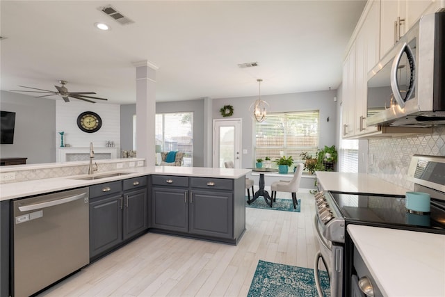 4405 Vista Meadows Dr, Fort Worth, TX 76244 - kitchen with appliances with stainless steel finishes, a sink, gray cabinetry, light countertops, and recessed lighting