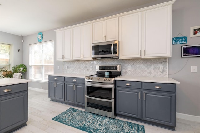 4405 Vista Meadows Dr, Fort Worth, TX 76244 - kitchen featuring appliances with stainless steel finishes, gray cabinets, tasteful backsplash, and baseboards