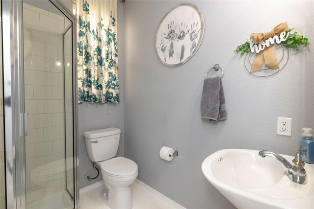 4405 Vista Meadows Dr, Fort Worth, TX 76244 - bathroom featuring a sink, a shower stall, toilet, baseboards, and tile patterned flooring