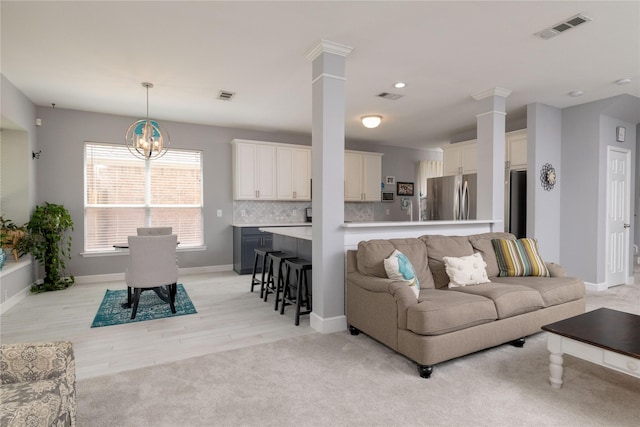 4405 Vista Meadows Dr, Fort Worth, TX 76244 - living area with ornate columns, a chandelier, baseboards, recessed lighting, and light wood-style floors
