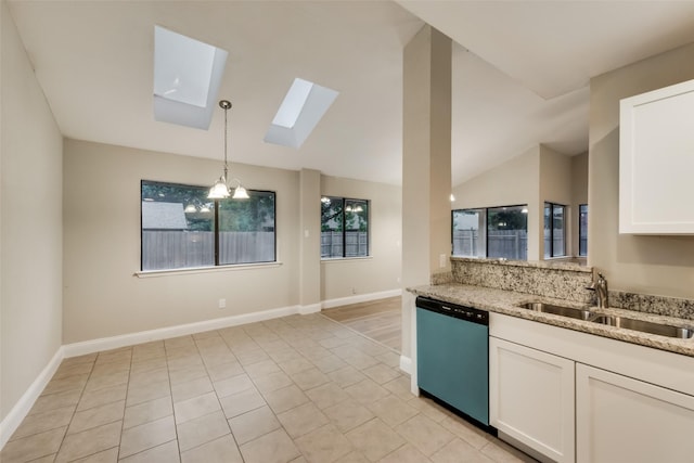 3301 Cliffview Dr, Corinth, TX 76210 - kitchen with dishwasher, a sink, a skylight, light stone countertops, and vaulted ceiling