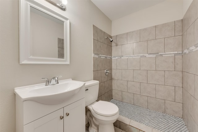 3301 Cliffview Dr, Corinth, TX 76210 - bathroom featuring toilet, vanity, and a tile shower